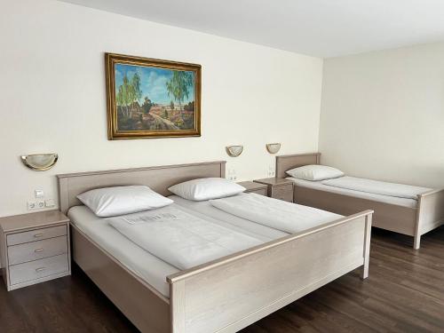 Postel nebo postele na pokoji v ubytování Hotel Fantasie