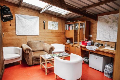 a room with two chairs and a table and a desk at Headgate Farm Camp Site - Pitches Only - Bring your own tent or van in South Molton