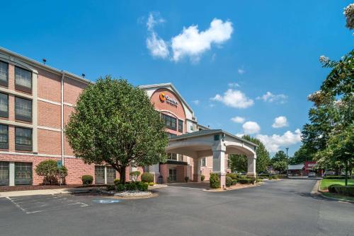 a building with a parking lot in front of it at Comfort Inn & Suites Lake Norman in Cornelius