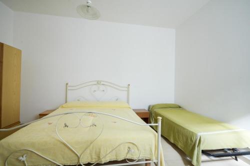 a hospital room with a bed and a chair at Beach House , Torre Canne - Nemo in Torre Canne