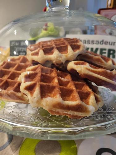 two waffles on a glass plate on a table at B&B Atuatuca in Tongeren