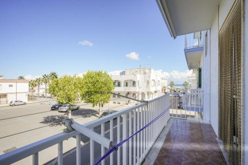 a balcony of a building with a view of a street at Beach House ,Torre Canne -Sebastian in Torre Canne