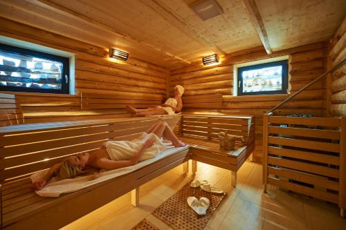 TV o dispositivi per l'intrattenimento presso Boutique Hotel Herzhof - Garni-Appartements - Adults Only