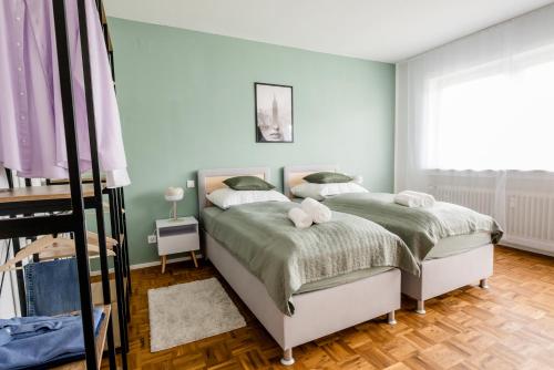 Ένα ή περισσότερα κρεβάτια σε δωμάτιο στο janu-homes - 3 Zimmer Apartment - 7 Betten, Lahnblick vom Rheinberg
