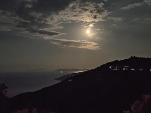 a view of the sun rising over a mountain at Panorama in Tsagarada