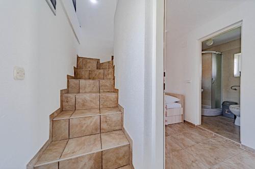 a staircase in a room with a bathroom at ENA Kuća za odmor in Ston