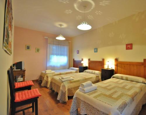 Katil atau katil-katil dalam bilik di Hotel Rural Aguallevada