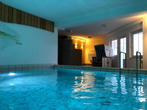 a large swimming pool in a hotel room at Residenz am Yachthafen, Whg 12 in Grömitz
