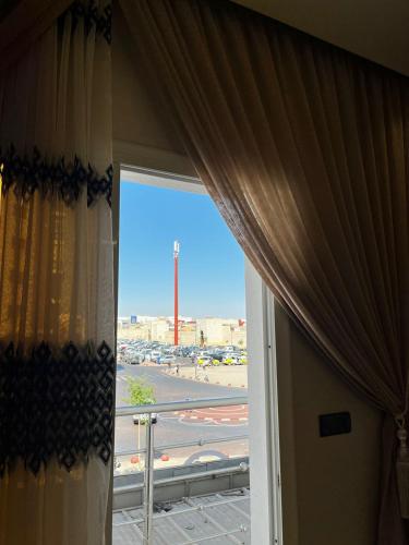 an open window with a view of an airport runway at Dar Hbabi in Agadir