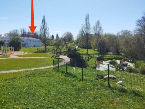 an image of a park with a red arrow at Charmant T2 flambant neuf pour 3 pers in Briec