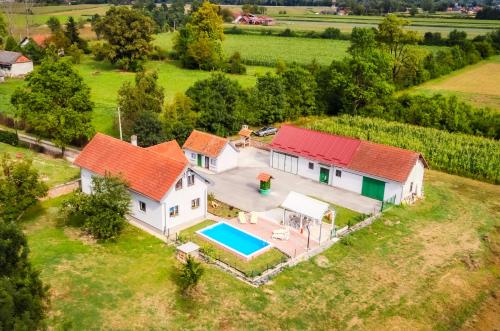 an aerial view of a house with a swimming pool at Green Oasis Estate with Private Pool and Backyard near Zagreb in Velika Gorica