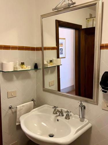 a bathroom with a sink and a mirror at Le Ginestre in San Gimignano