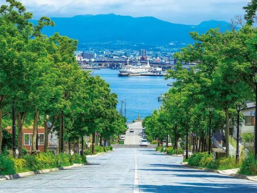 an empty street with a view of a river at Tasogare Apartment 201 in Hakodate