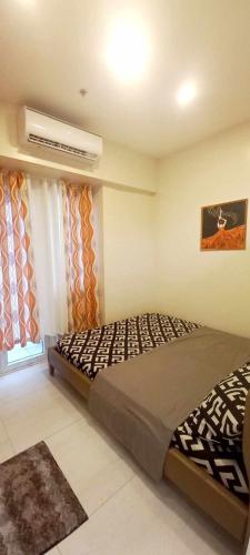 Postel nebo postele na pokoji v ubytování Paradise Point Staycation