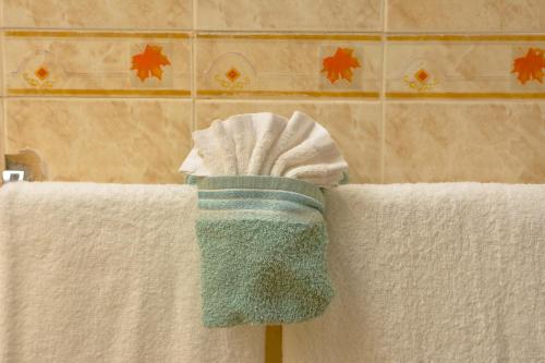 a pair of towels sitting on top of two towels at Veronica Villa 68 in Lucea