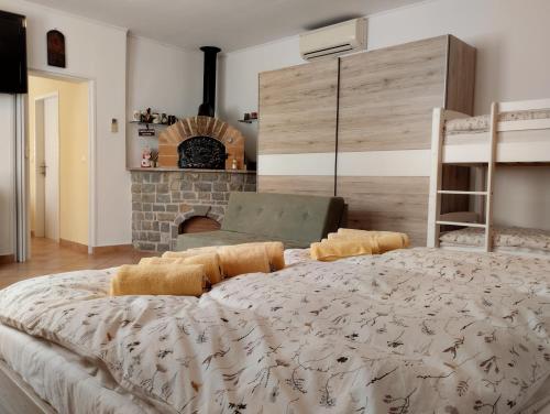 a bedroom with a large bed and a fireplace at Apartment Rose in Koper