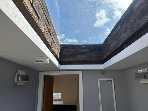 a skylight in the ceiling of a room at Entire Seaside Home 6 Private Bedrooms Sleeps 10 in Wallasey