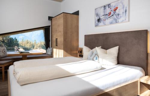 Posteľ alebo postele v izbe v ubytovaní Das Aparthotel Olympia Tirol