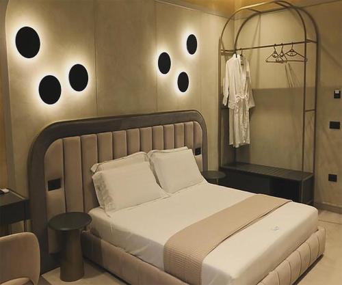 a bedroom with a bed with three eyes on the wall at Comfort Suites in Golem