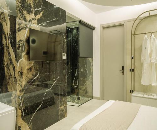 a bathroom with a shower and a sink at Comfort Suites in Golem