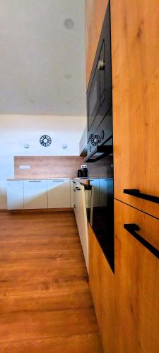a kitchen with a tv on a counter top at Three Diamonds Residence in Dunajská Streda