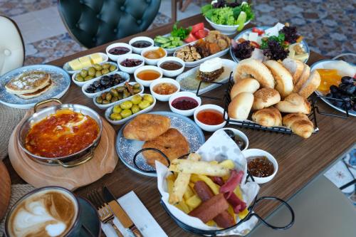 a table with a bunch of different types of food at Ada Port Hotel Adults Only in Alanya