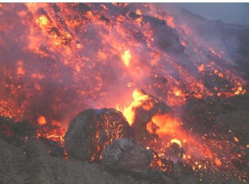a close up of a fire with rocks in it at Casa Orchidea Mazzeo in Mazzeo