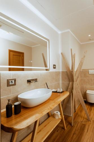 a bathroom with a white sink and a mirror at Castello di Pandora in Nepi