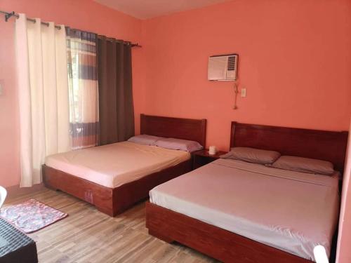 Voodi või voodid majutusasutuse Saki's inn toas