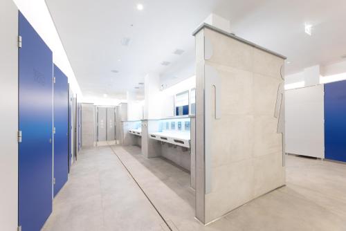 a hospital hallway with blue and white walls at Camping Bungalow Lido in Capoliveri