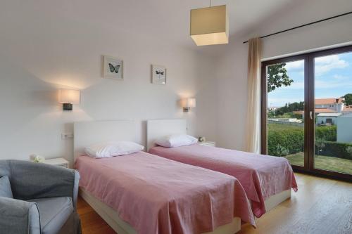 Postel nebo postele na pokoji v ubytování Villa Luna Rossa