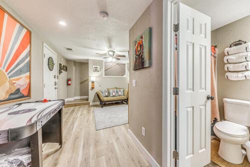 a bathroom with a toilet and a sink at Peaceful Ruidoso Cabin Hot Tub, Mountain Views! in Ruidoso