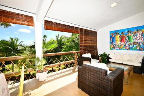 a living room with a view of the ocean at Villa de la Vallée in Rodrigues Island