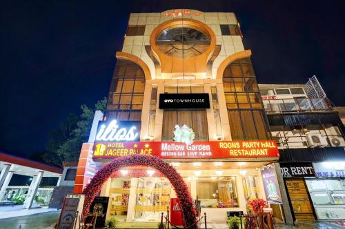 a building with a clock on the front of it at Super Hotel JP Palace in New Delhi