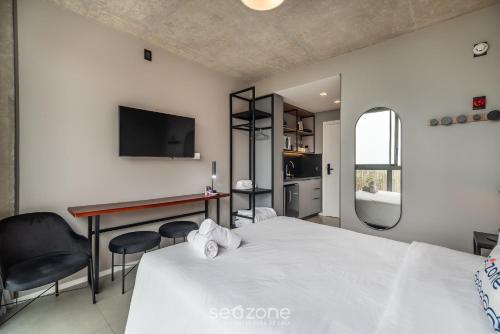 Cama o camas de una habitación en Spot Jurere sofisticación junto al mar - SPJ's