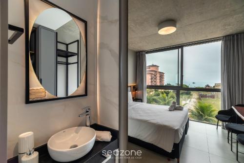 Cama o camas de una habitación en Spot Jurere sofisticación junto al mar - SPJ's