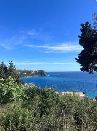 a view of the ocean from a hill at Adrianas Guest House in Himare