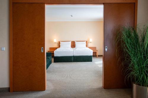 Best Western Premier Airporthotel Berlinにあるベッド