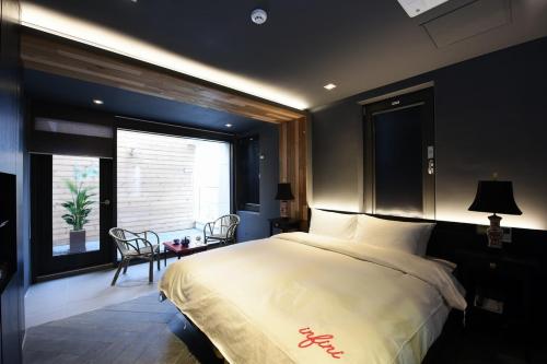Postel nebo postele na pokoji v ubytování Hotel Infini