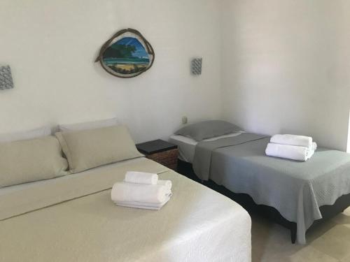 Ein Bett oder Betten in einem Zimmer der Unterkunft Taiba Beach Resort - Ap 106 BL A - IMOB TEMPORADA