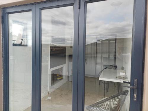 a sliding glass door with a view of a balcony at On 36 Neethlingshof in Cape Town