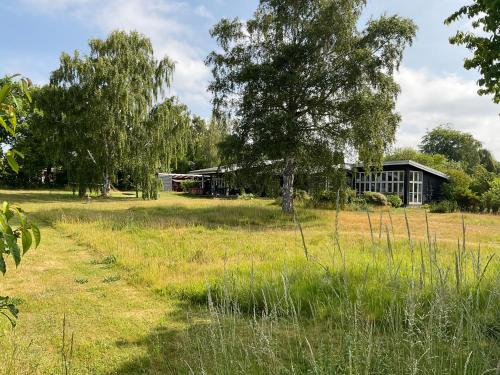 a house in the middle of a field at Sunset over water, 50 mins from Copenhagen in Skibby