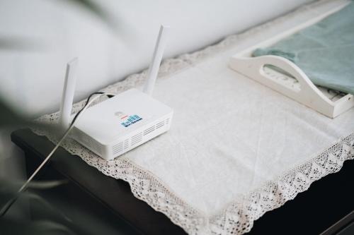 a hospital bed with a white router on a table at Holiday House Aguacate 2 in San Sebastián de la Gomera