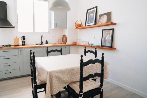 a kitchen with a bed with a table in it at Holiday House Aguacate 2 in San Sebastián de la Gomera