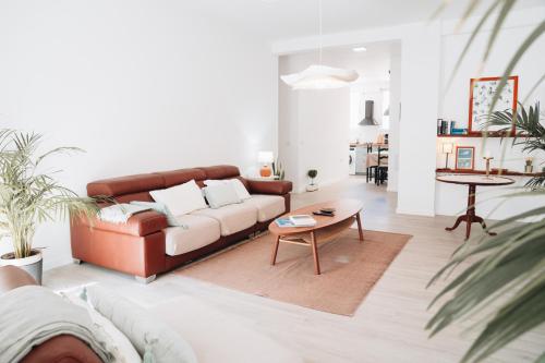 a living room with a couch and a table at Holiday House Aguacate 2 in San Sebastián de la Gomera
