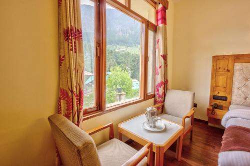 Posezení v ubytování HOTEL ROyAL THE MALL MANALI