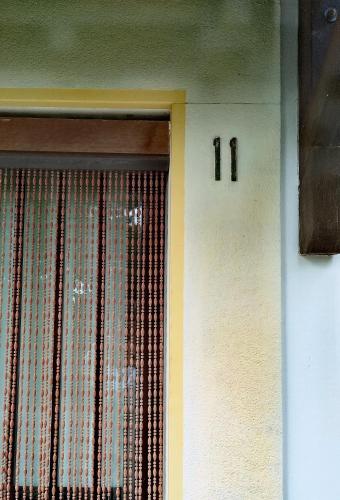 a door with a window with the number on the wall at Holiday Residence in Casamassima