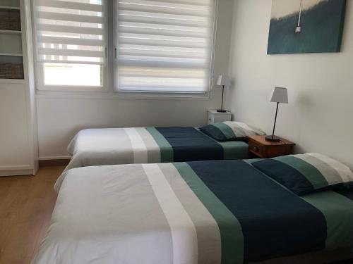 Postel nebo postele na pokoji v ubytování Appartement vue mer