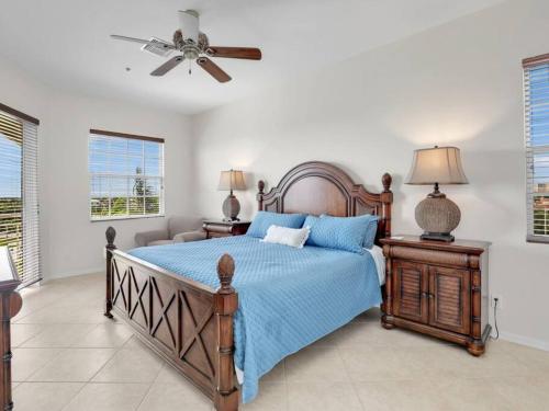 a bedroom with a bed and a ceiling fan at Elevated 886 Amazing Condo Park View in Marco Island