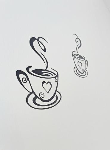 a cup of coffee with a heart on it at Apartman Danijela in Popovača